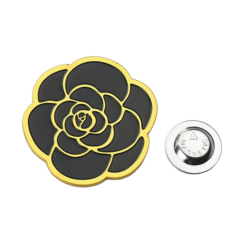 Black flower enamel piece shown with a separate magnetic backing